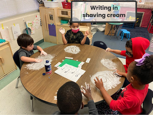Pre-k Students writing in shaving cream