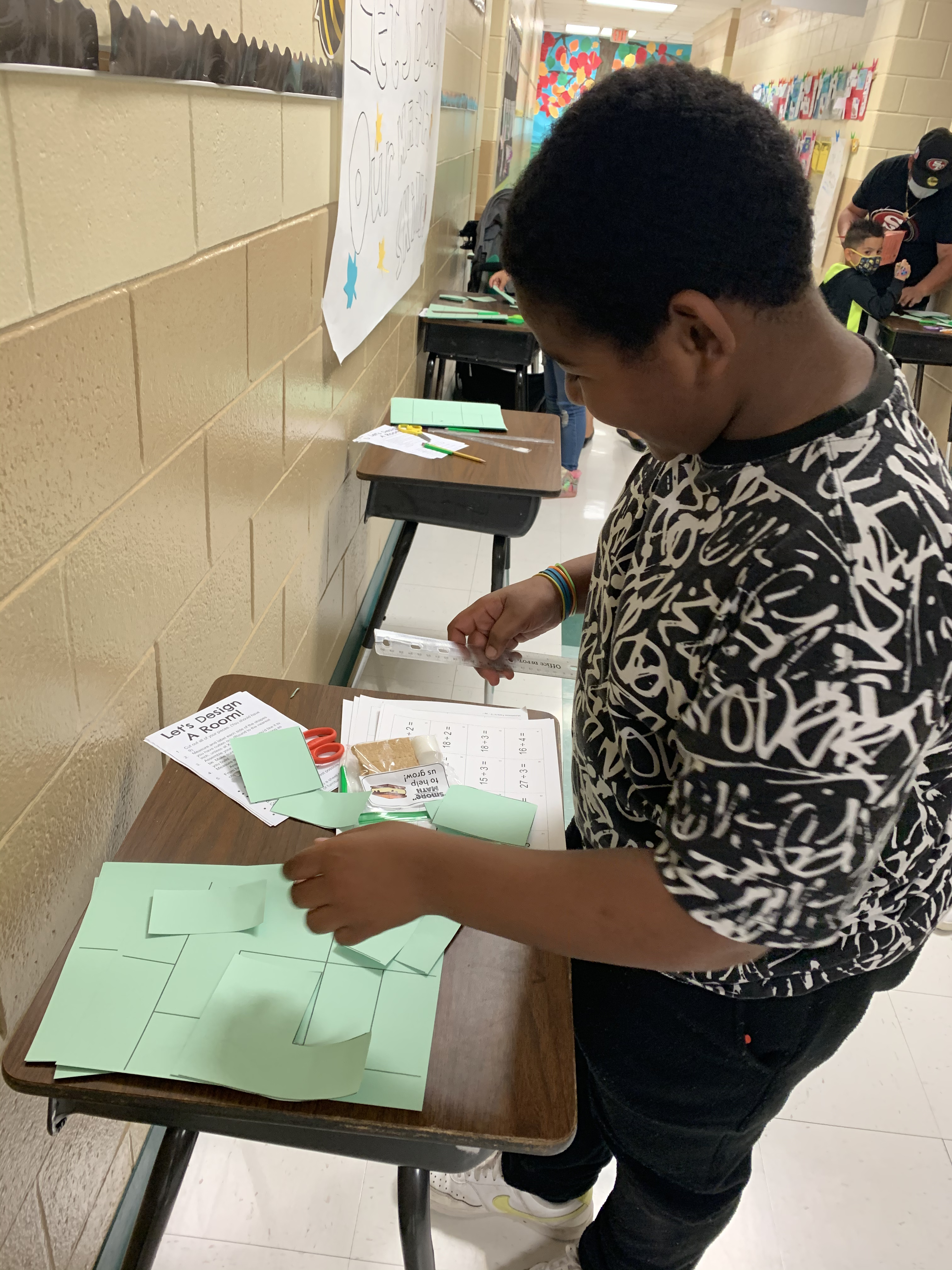 African American student playing math game.