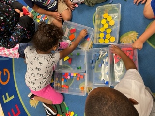 Students playing with blocks. 