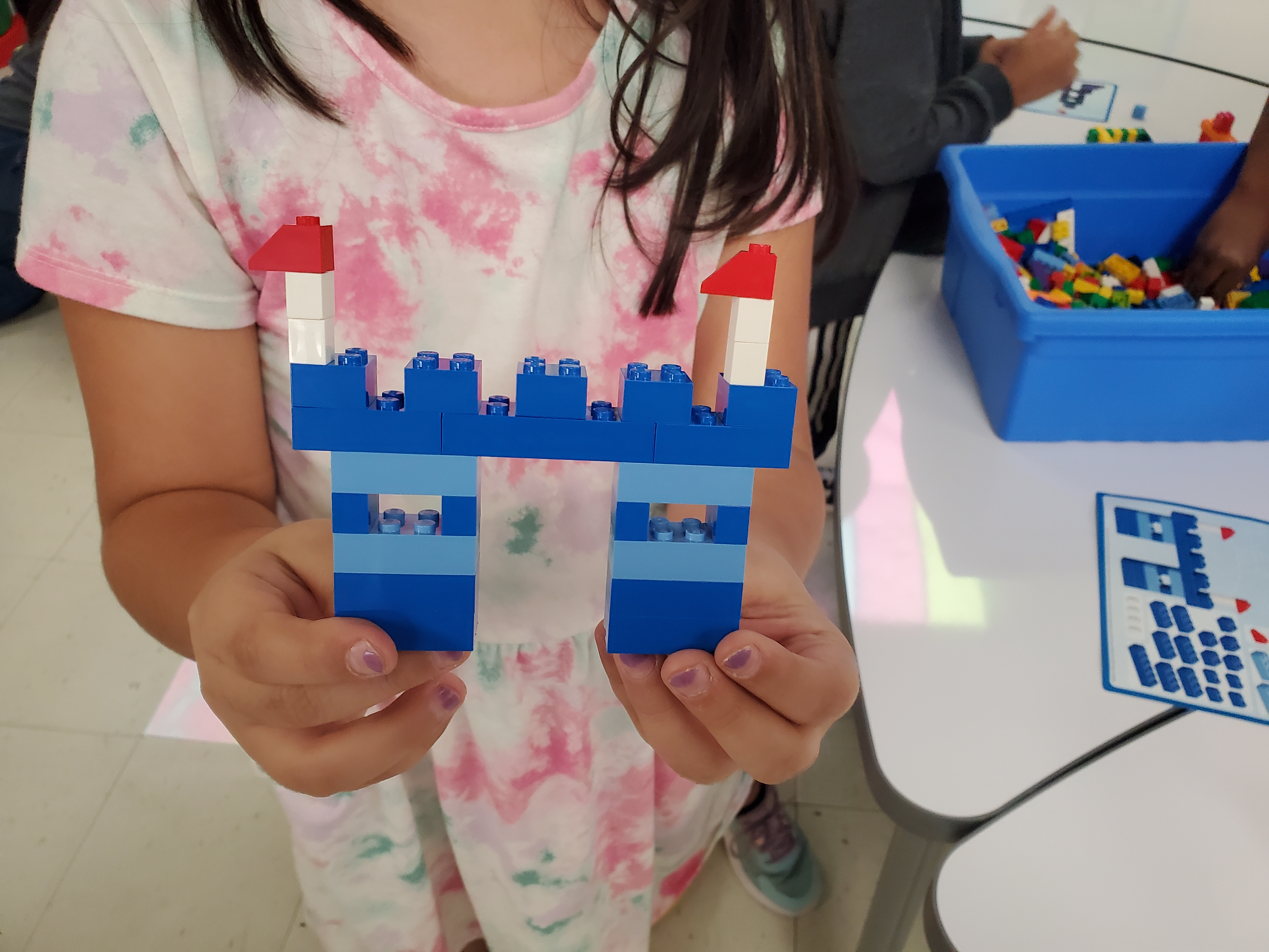Students building with Legos
