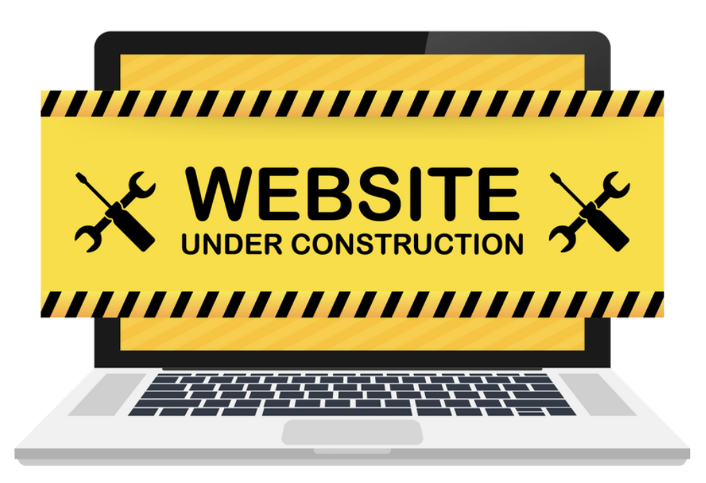 Stock photo of an opened laptop with "Website Under Construction" message on the screen. 