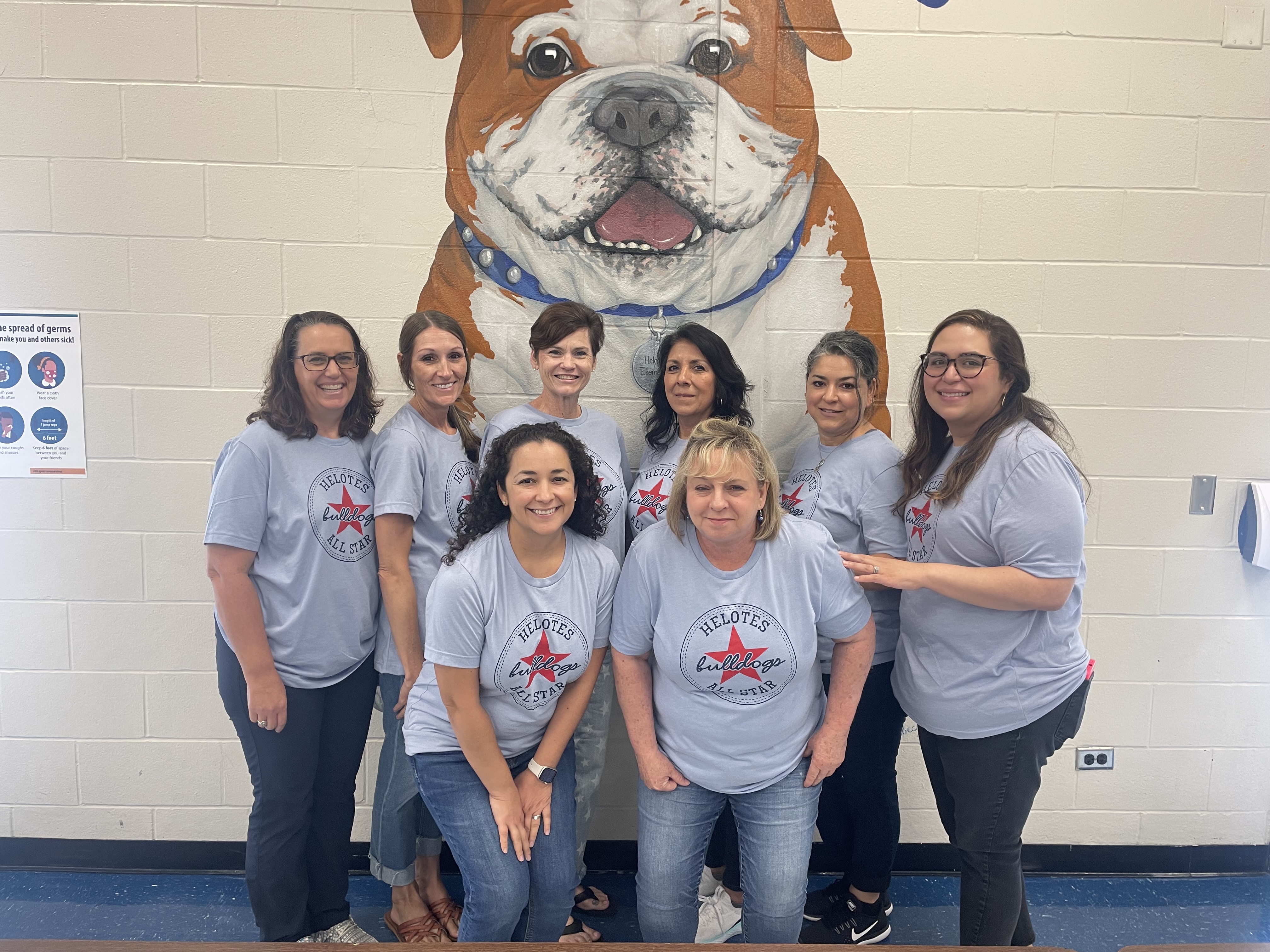 Helotes Special Education Teachers in front of Bulldog mural