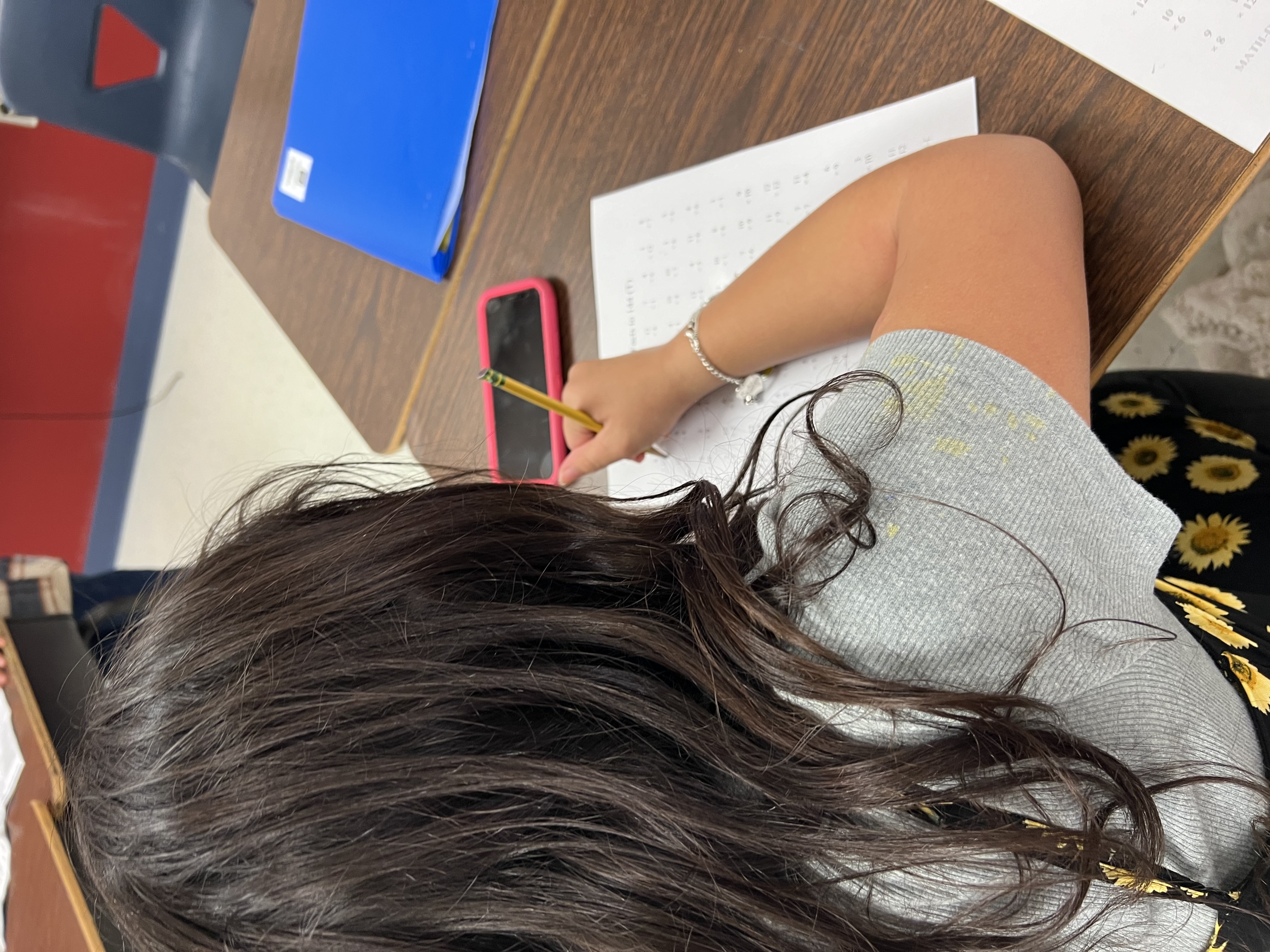 Student working on homework during the time at learning tree