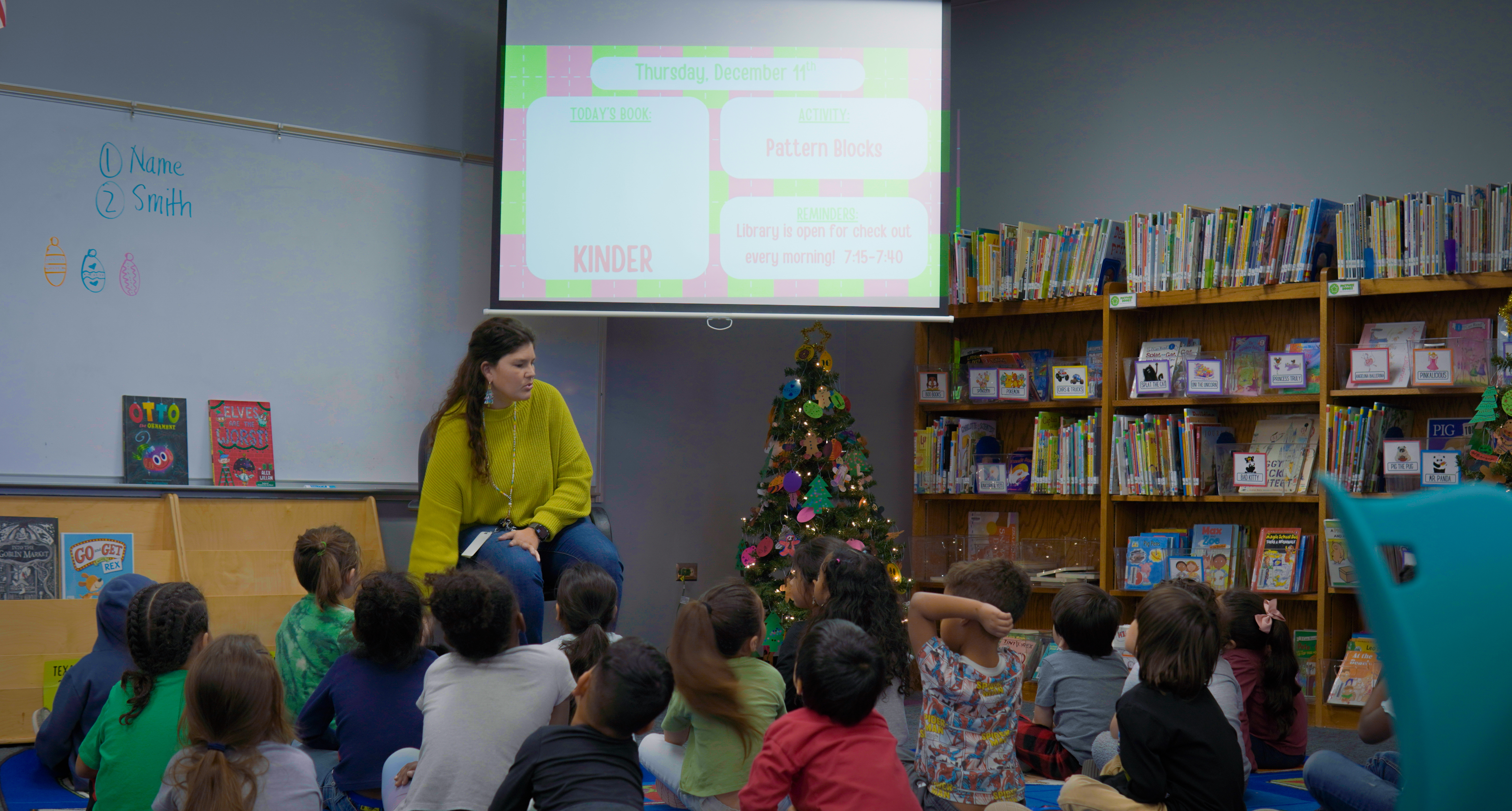 Librarian, Ms Johnson, walking students through their library lesson