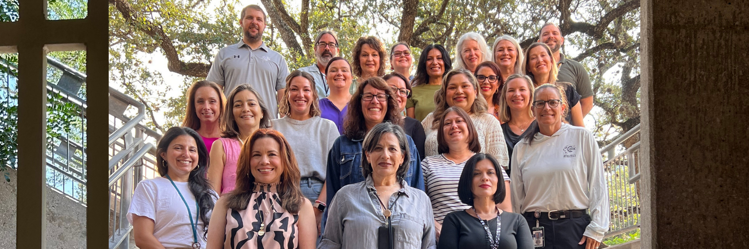 Group photo of the 2025-2026 Clark English Department outside in the Clark Courtyard