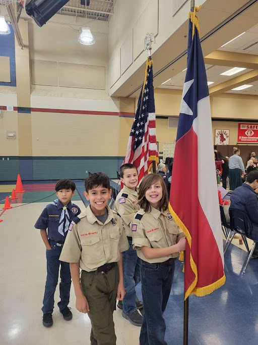 Carnahan students carrying our state and national flags