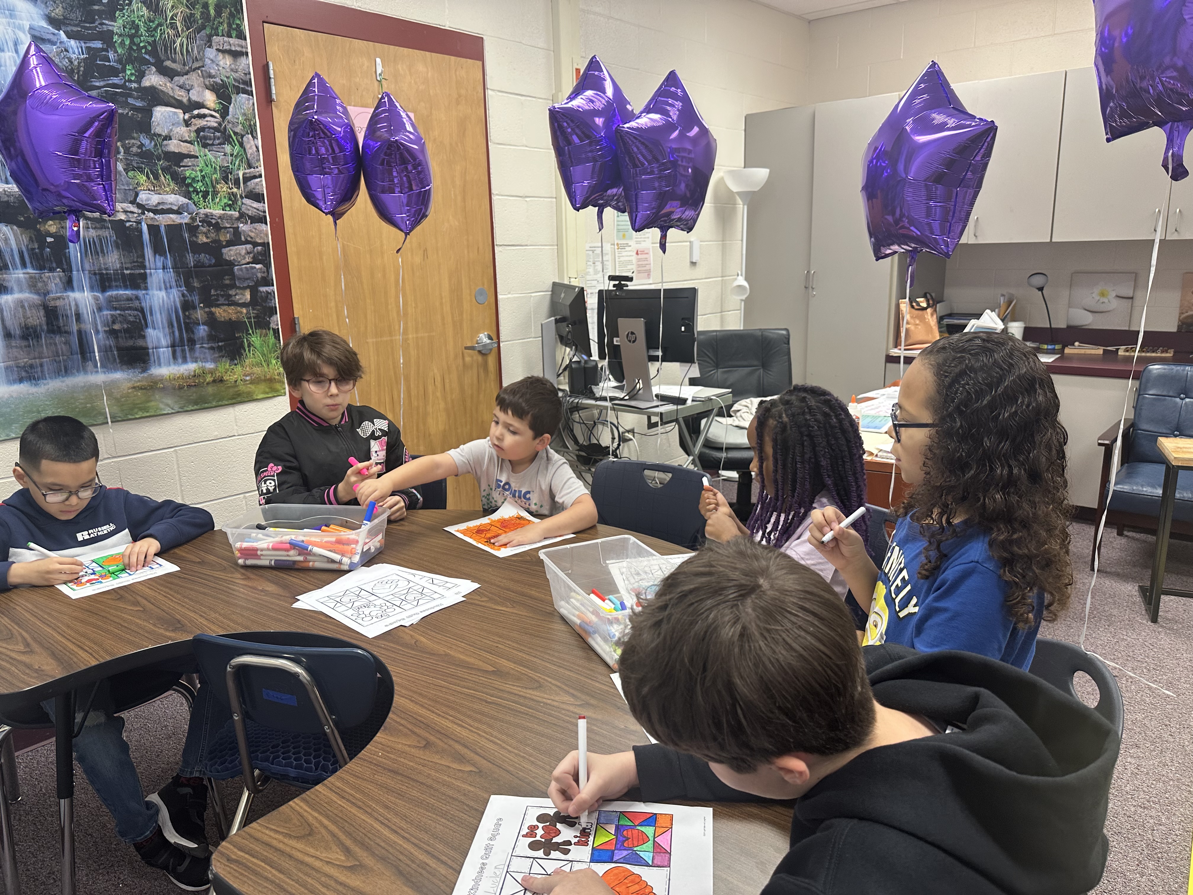 Our military kids club working on a project