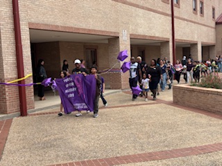 Another angle of the Purple Up parade