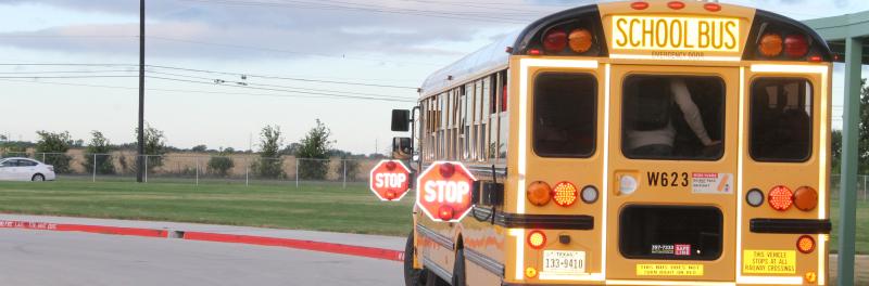 School bus in campus driveway