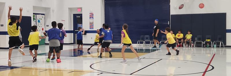Children Playing Basketball In Gym