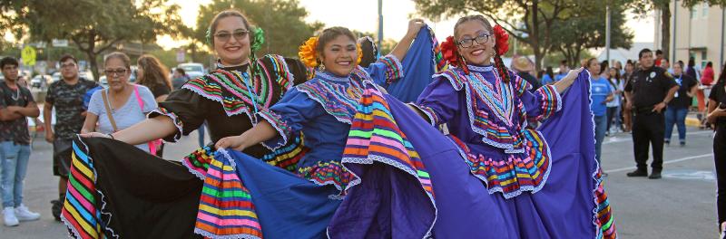 folklorico students posing in their outfits