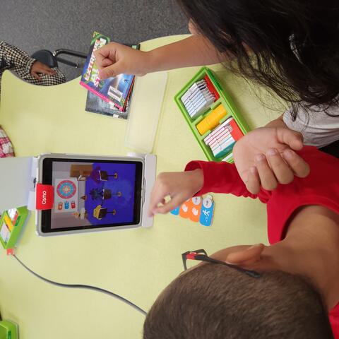 Students working with the Osmos.