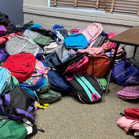 stack of backpacks