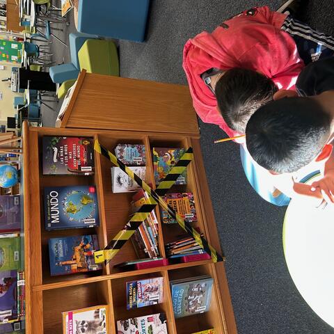 Students analyzing shelf crimes and figuring out how to fix them.