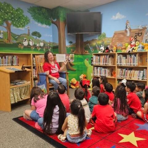 Mrs. Romero reading to students