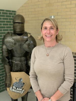 Academic Dean Carrie Moix in front of Black Knight  