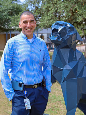 Mr. Martinez with the panther statue.