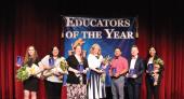 Educators of the Year backdrop with 6 winner teachers standing in front