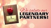 Award plaque with apple; words 'We salute our legendary partners'