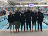 Clark HS boys team poses in front of pool in state competition
