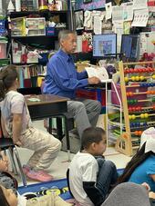 Trustee David Salcido reads