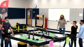 Teams of students compete in LEGO robotics